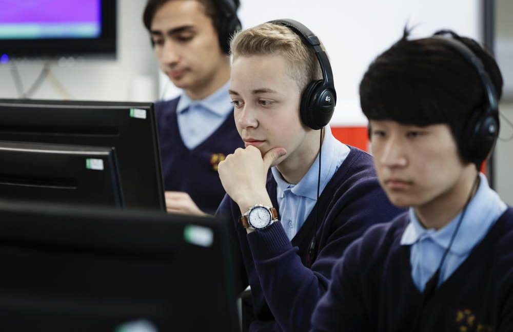 children wearing head phones