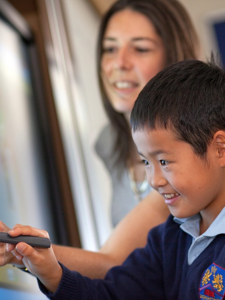 young student working with his teacher