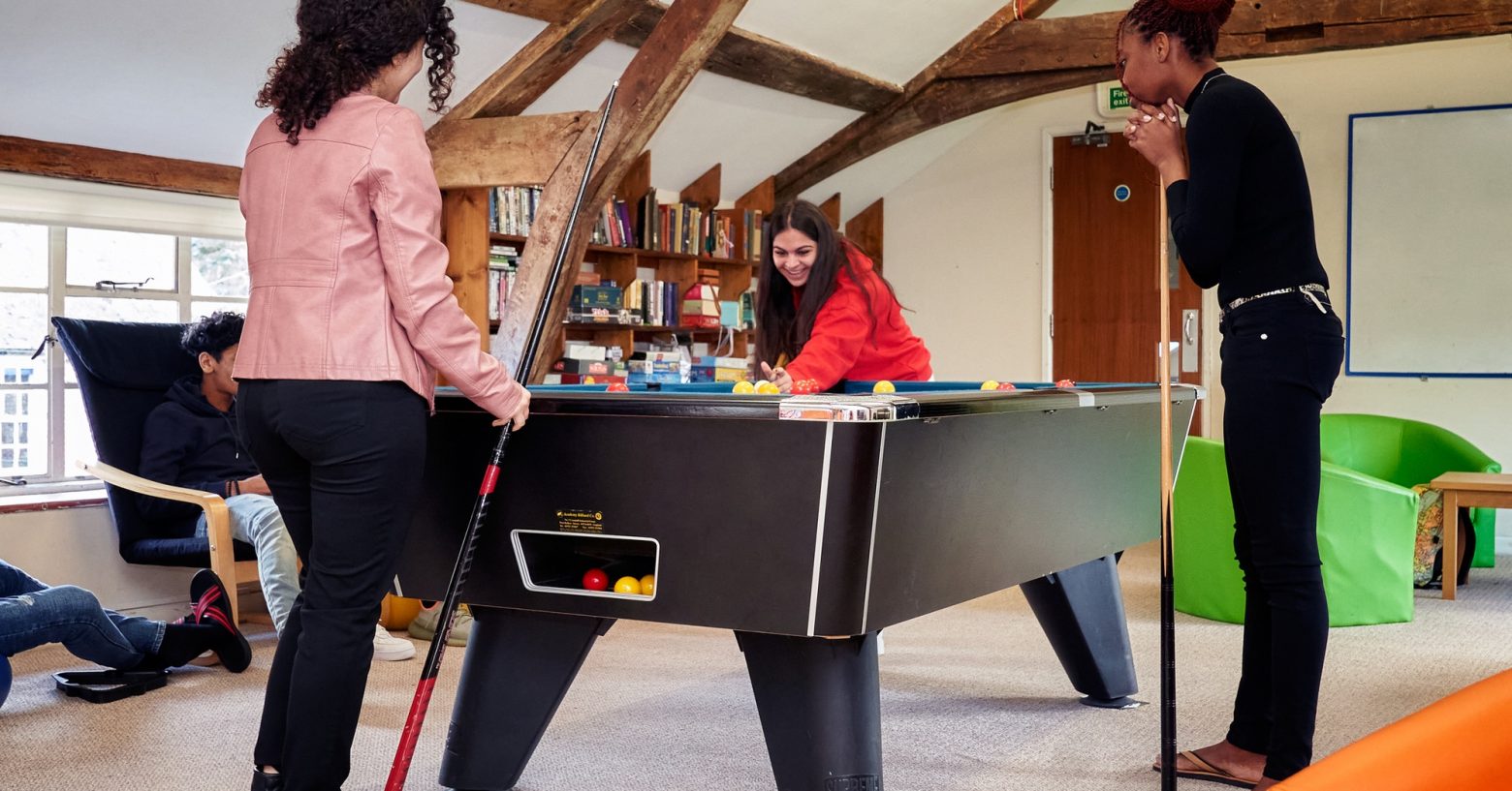 Students playing pool