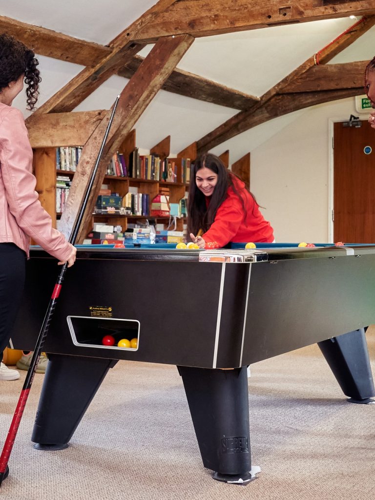 Students playing pool