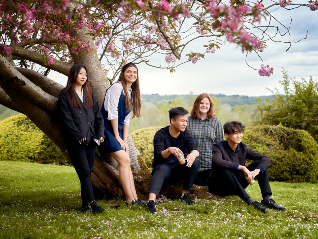 Padworth students sitting under a tree