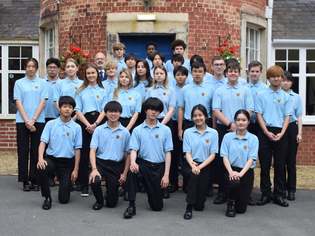 Senior students standing infront of school building