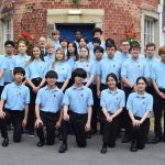 Senior students standing infront of school building